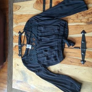 Black cropped top with bell sleeves and lace detail